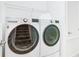 Laundry room with LG washer and dryer, and overhead shelving at 8920 Dove Valley Way, Davenport, FL 33896