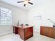 Home office with a large desk and ample natural light at 8920 Dove Valley Way, Davenport, FL 33896