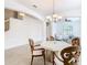 Open concept dining area with a round table and access to living spaces at 8920 Dove Valley Way, Davenport, FL 33896