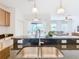 Kitchen island with double sink and granite countertops at 8920 Dove Valley Way, Davenport, FL 33896