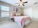 Bedroom with queen bed and ceiling fan at 8920 Dove Valley Way, Davenport, FL 33896