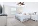 Spacious primary bedroom with carpeted floors and large window at 8920 Dove Valley Way, Davenport, FL 33896