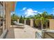 Relaxing balcony overlooking lush tropical landscape and a partial view of the street at 5174 Vardon Dr, Windermere, FL 34786
