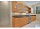 Wet bar with granite countertop and built-in beverage cooler at 5174 Vardon Dr, Windermere, FL 34786