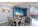 Beach-themed dining area with a white table and comfortable seating at 3052 Secret Lake Dr, Kissimmee, FL 34747