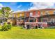 Back view of townhouses, showing private screened patios and pool areas at 3052 Secret Lake Dr, Kissimmee, FL 34747