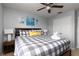 Comfortable bedroom featuring a king-size bed, nightstands, and artwork at 3052 Secret Lake Dr, Kissimmee, FL 34747
