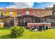 Rear view of colorful townhomes with private screened-in pools at 3052 Secret Lake Dr, Kissimmee, FL 34747