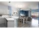 Open concept kitchen and dining area with beach-themed decor at 3052 Secret Lake Dr, Kissimmee, FL 34747