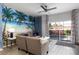 Living room with pool view, featuring comfortable seating at 3052 Secret Lake Dr, Kissimmee, FL 34747
