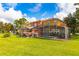 Townhouse community with a shared pool and lush green lawn at 3052 Secret Lake Dr, Kissimmee, FL 34747