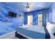 Spacious bedroom with Star Wars mural, a comfy bed, and plenty of natural light at 3052 Secret Lake Dr, Kissimmee, FL 34747