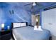 Second bedroom with Star Wars theme, comfortable bed, and ample closet space at 3052 Secret Lake Dr, Kissimmee, FL 34747