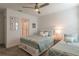 Bedroom with a full-size bed, a twin-size bed, and access to a private bathroom at 9102 Sommerset Hills Dr, Davenport, FL 33896