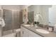 Double vanity bathroom with walk-in shower at 9102 Sommerset Hills Dr, Davenport, FL 33896