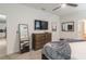 Bedroom with dresser, TV, and comfy bed at 9102 Sommerset Hills Dr, Davenport, FL 33896