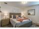 King-size bed and gray wood furniture at 9102 Sommerset Hills Dr, Davenport, FL 33896