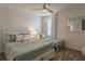 Spacious bedroom with a full-size bed, a twin bed, and plenty of pillows at 9102 Sommerset Hills Dr, Davenport, FL 33896
