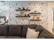 Game room with sectional sofa, shelving, and Star Wars themed decor at 9102 Sommerset Hills Dr, Davenport, FL 33896