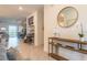 Stylish entryway with console table and large mirror at 9102 Sommerset Hills Dr, Davenport, FL 33896