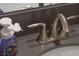 Bathroom sink with brushed nickel faucet and soap dispenser at 9102 Sommerset Hills Dr, Davenport, FL 33896