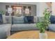 Modern living room with sectional sofa, coffee table and stylish decor at 9102 Sommerset Hills Dr, Davenport, FL 33896