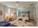 Bedroom with bunk beds, Mickey Mouse rug and calming decor at 9102 Sommerset Hills Dr, Davenport, FL 33896