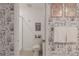 Clean bathroom with shower, toilet, and Star Wars decor at 9102 Sommerset Hills Dr, Davenport, FL 33896