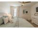 Bedroom with queen bed, calming decor, and a large mirror at 9102 Sommerset Hills Dr, Davenport, FL 33896