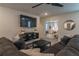Game room with sectional sofa, mounted TV, and view of another bedroom at 9102 Sommerset Hills Dr, Davenport, FL 33896