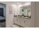Double vanity bathroom with modern finishes at 9102 Sommerset Hills Dr, Davenport, FL 33896