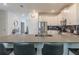 Modern kitchen with gray countertops, white cabinets, and stainless steel appliances at 9102 Sommerset Hills Dr, Davenport, FL 33896