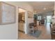 Bright and airy entryway with a bench and view to living room at 9102 Sommerset Hills Dr, Davenport, FL 33896