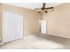 Bright bedroom featuring a double door closet at 125 Calabria Springs Cv, Sanford, FL 32771