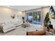 Bright living room with patio access and comfortable seating at 17204 Blessing Dr, Clermont, FL 34714