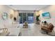 Bright living room with pool view, comfy seating, and large TV at 17204 Blessing Dr, Clermont, FL 34714
