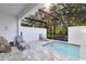 Private screened pool and patio area with lounge chairs at 17204 Blessing Dr, Clermont, FL 34714