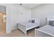 Two twin beds in a well-lit bedroom with neutral decor at 17204 Blessing Dr, Clermont, FL 34714