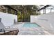 Private screened pool and patio area with lounge chairs at 17204 Blessing Dr, Clermont, FL 34714