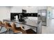 Modern kitchen with breakfast bar and stainless steel appliances at 17204 Blessing Dr, Clermont, FL 34714