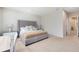 Main bedroom with king-size bed and adjacent workspace at 17204 Blessing Dr, Clermont, FL 34714