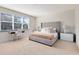 Main bedroom with plush bed, window, and workspace at 17204 Blessing Dr, Clermont, FL 34714