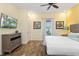 Spacious bedroom with a king-size bed and a dresser at 8063 Knee Deep Rd, Kissimmee, FL 34747