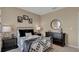 Bedroom with metal bed frame and checkered bedding at 4105 Giorgio Dr, Winter Haven, FL 33884