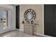 Elegant entryway with a console table and a large mirror at 4105 Giorgio Dr, Winter Haven, FL 33884