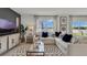 Living room features a large sectional sofa, coffee table, and access to backyard at 4105 Giorgio Dr, Winter Haven, FL 33884
