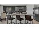 Kitchen island with seating for three and granite countertop at 4105 Giorgio Dr, Winter Haven, FL 33884