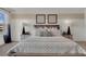 King-size bed, two nightstands, and large windows at 4105 Giorgio Dr, Winter Haven, FL 33884