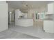 Open concept kitchen with breakfast bar and tile flooring at 2717 Bayview Dr, Eustis, FL 32726