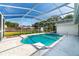 Relaxing kidney-shaped pool with screened enclosure at 2717 Bayview Dr, Eustis, FL 32726